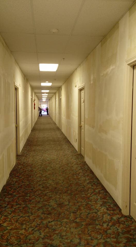 LAZO Construction commercial hallway drywall finish