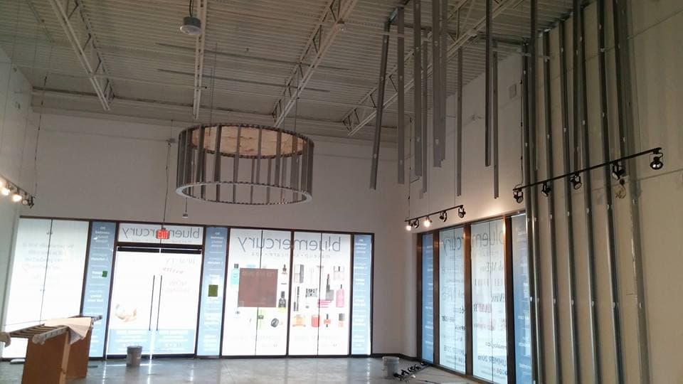 LAZO Construction commercial shell space build-out with exposed ductwork and custom lighting